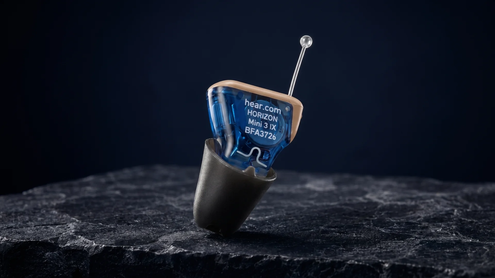 A blue IX hearing aid on a slate pedestal